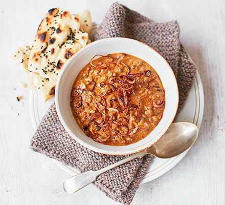 Creamy black dhal with crispy onions