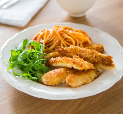 Chicken schnitzel strips with tomato spaghetti