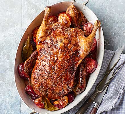 Roast spiced duck with plums