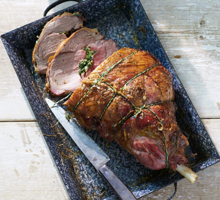 Hay-baked stuffed leg of lamb