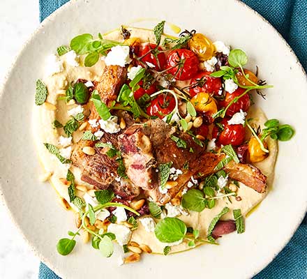 Lamb chops with hummus & roasted tomatoes