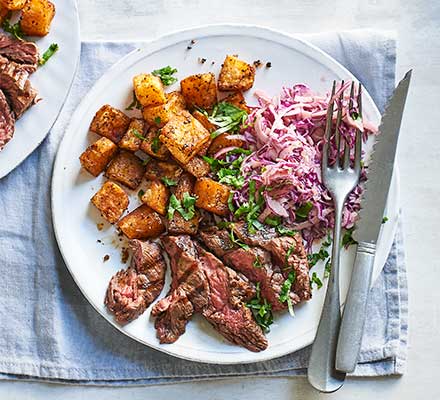 Smoky steak with Cajun potatoes & spicy slaw