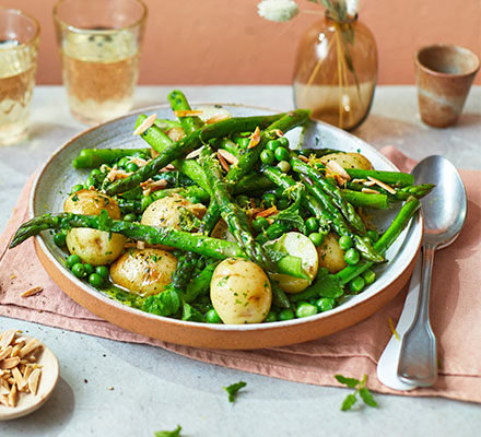 Asparagus with peas, mint & Jersey Royals in wild garlic butter