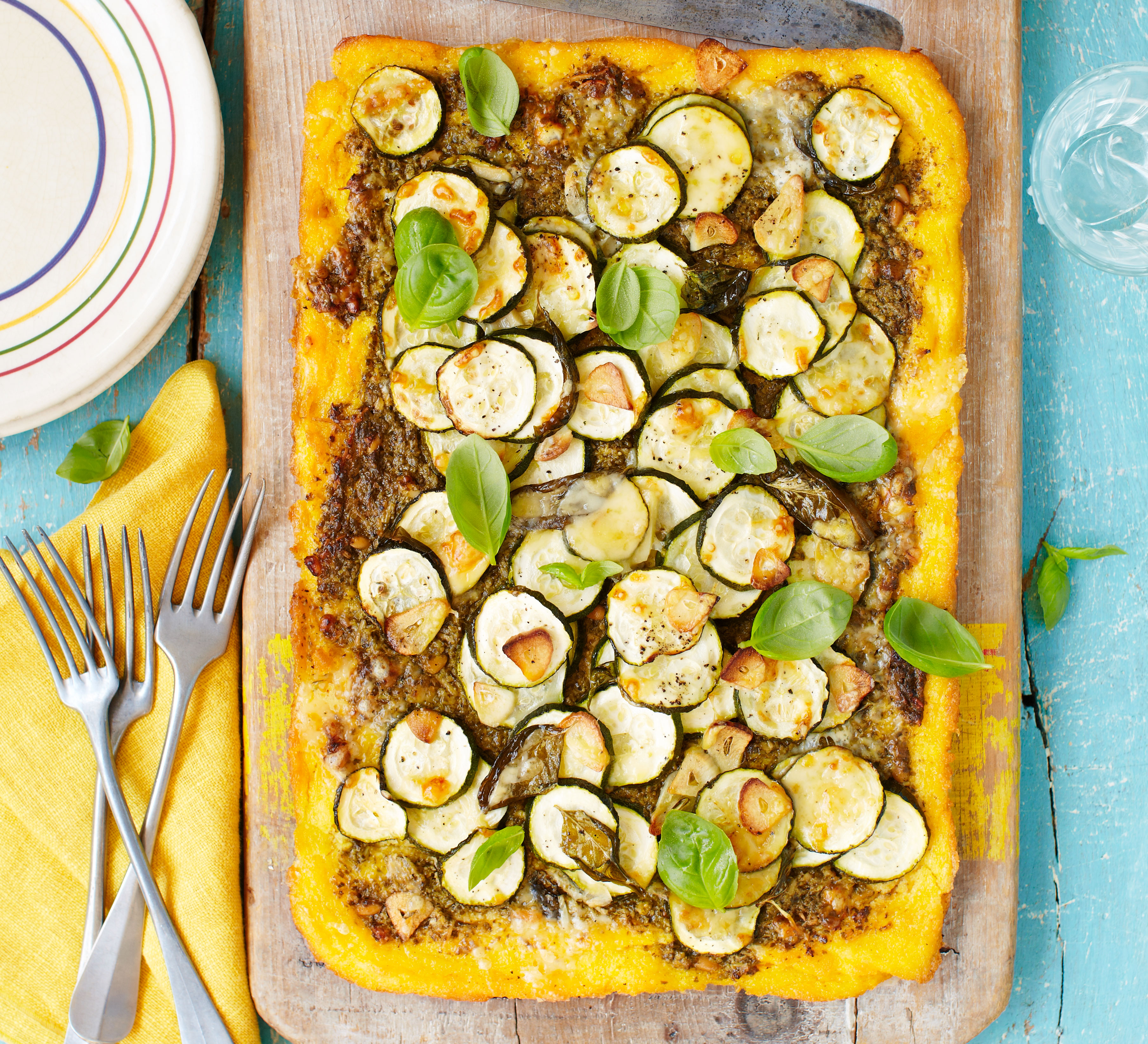 Crusted polenta tart with pesto, courgette & gruyère