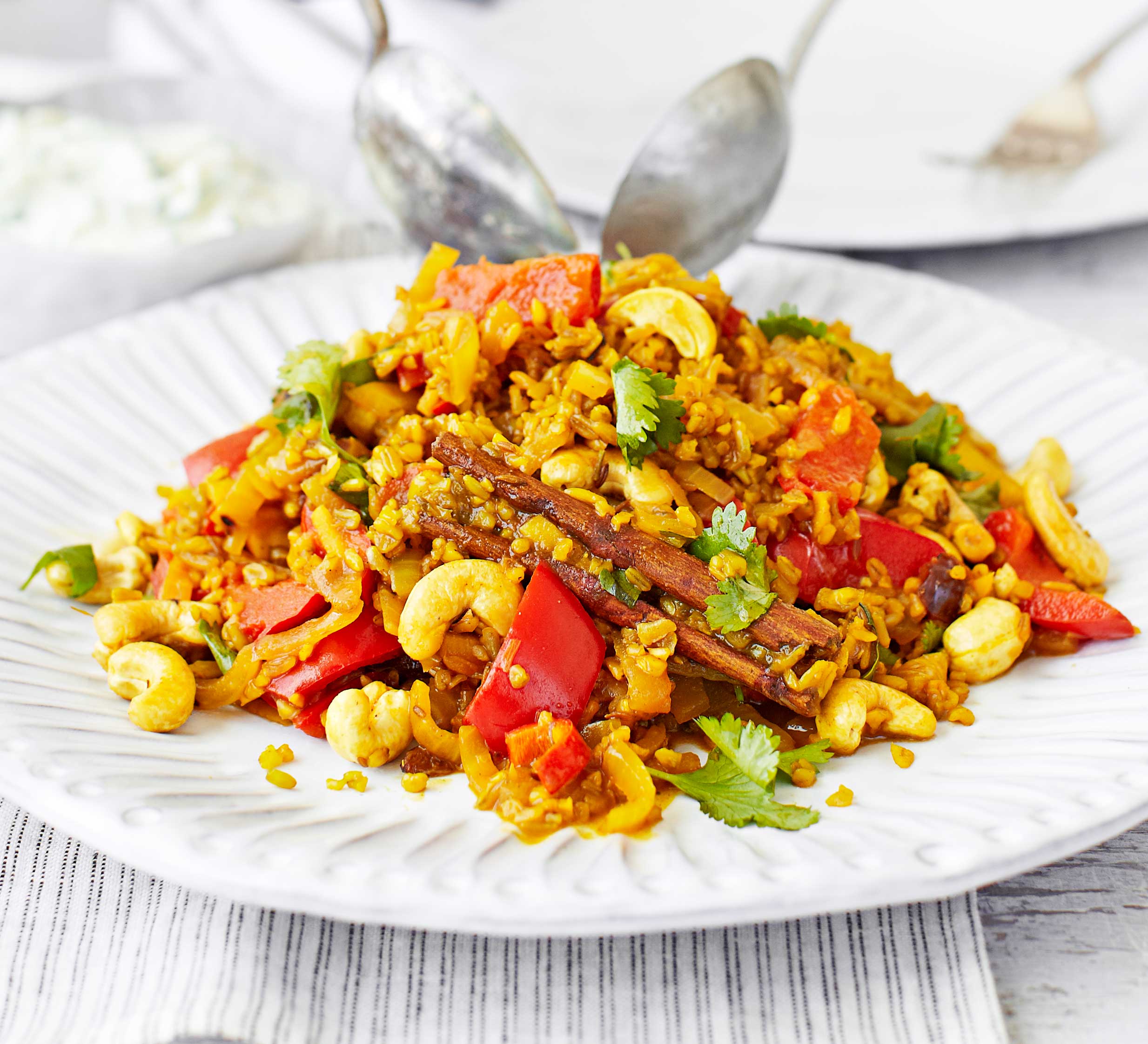 Spicy vegetable pilau with cucumber raita