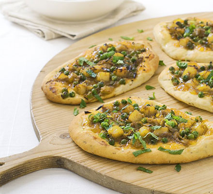 Spicy pizza breads with raita salad