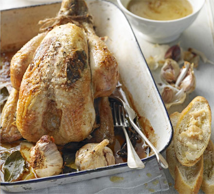 Roast chicken with whole garlic, bay & white wine