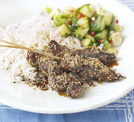 Oriental beef skewers with cucumber salad