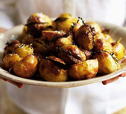 Herby slashed roasties