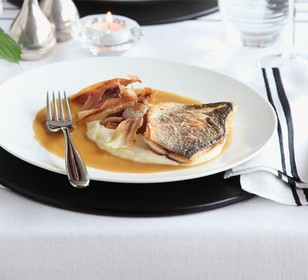 Roast fillet of sea bass with parsnip purée & caramelised garlic