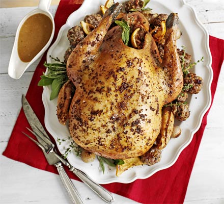 Roast turkey with pecan, sausage & chestnut stuffing & roast shallots