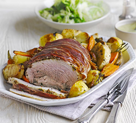 Herb roast pork with vegetable roasties & apple gravy