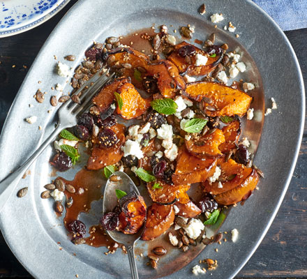 Roasted squash with sour cherries, spiced seeds & feta