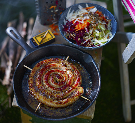 Sticky cider & mustard sausage wheel with box grater salad