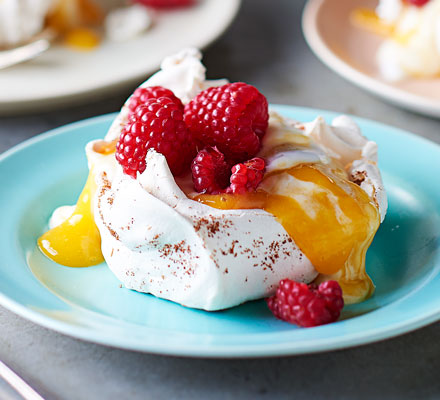 Star anise meringues with mango coulis & raspberries